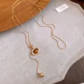 Collier vintage style Maillard avec pierre œil de tigre et chaîne dorée réglable - Design Ovale / Or