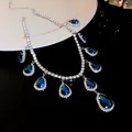 Detailed close-up of a luxury blue teardrop crystal necklace with shimmering pavé stones - Necklace (HE16003-HN4381) / Blue