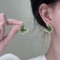 Detailed view of green butterfly stud earrings featuring a faceted center and crystal border - Gold Plated Style (7#)
