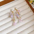 Elegant resin flower tassel earrings with pearls and silver pins for fashion-forward women - Tassel Flower Style / Pink