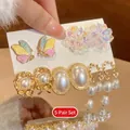 Detailed macro of the 5-pair butterfly and pearl earring set with silver needles - 6# Silver Post Style