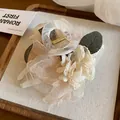 Close-up of elegant Mori-style flower mesh hair claw clip on linen display tray - Champagne - Claw Clip
