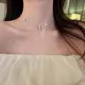 Élégant collier de perles vintage français avec un pendentif papillon en argent brillant - Collier Choker Papillon Argenté