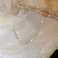 Collier ras du cou élégant et minimaliste avec perles facettées dorées pour femmes - Ras du cou Perles Métalliques Facettées Or Champagne