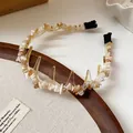 Close-up of the elegant acrylic headband with irregular amber stone chips detail - Irregular Crushed Stone Style / White