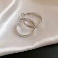 Detailed macro view showing the frosted texture and twill pattern on silver hoop earrings - Diameter 30MM / Silver
