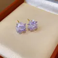 Close-up of elegant lavender crystal flower stud earrings with gold posts - Flower / Purple/Gold