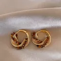 Close-up detail of luxury gold-plated hoop earrings featuring faceted brown beads and mesh - Style 4 Ear Clip / Gold Brown