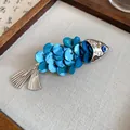 Elegant vintage ethnic style fish-shaped hair clip with blue shell scales and silver accents - Left Side Style / Single Piece / Silver-Blue