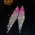 Macro view of sparkling pink gradient rhinestone tassel earrings on a dark surface - Gradient Rose Red Square Tassel