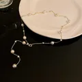 Elegant French Baroque style gold chain necklace featuring multiple white pearls - Tassel Style