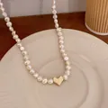 Elegant French style Baroque pearl necklace featuring a matte gold heart pendant detail - Real Gold Plated Heart Style