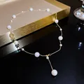 Elegant French Baroque pearl necklace featuring iridescent beads on a thin gold chain - Iridescent Mermaid Style