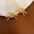 Orecchini a perno a nodo placcati oro con texture a spirale su elegante seta bianca - 46# Perno Argento - Oro