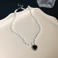 Elegant French baroque pearl necklace with a black heart pendant in silver finish. - Heart Style
