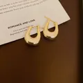 Eleganti orecchini a cerchio minimalisti a forma di U dorati con perni in argento per donna. - 61# Orecchino - Oro
