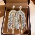 Close-up of elegant court-style tassel earrings with pearls and crystals in a gift box - 12# Silver Pin-White