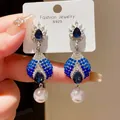 Macro view of vintage court style blue crystal earrings with elegant pearl drops - 14# Silver Needle - Silver - Blue - White