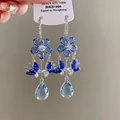 Detailed view of vintage blue zircon flower and butterfly tassel earrings in S925 silver - 15# Ear Hook - Blue