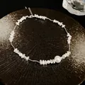 Detail view of titanium steel bracelet with pearls and irregular silver-tone beads. - Necklace / Silver
