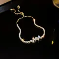 Macro view of adjustable golden zircon bracelet featuring marquise-cut leaf shaped stones - Butterfly Style (7#)