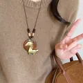Vintage style golden horse pendant necklace with wooden base and brown bead cord accessory - Gold Brown Wooden Base Necklace (43#)