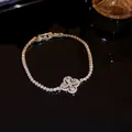 Elegant gold-plated zircon bracelet featuring a sparkling four-leaf flower charm detail - Clover Style (24#)