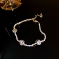 Elegant golden bracelet featuring sparkling zircon stones and camellia floral charms for women - Camellia Style (43#)