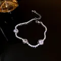 Elegant silver-toned tennis bracelet with three sparkling zircon flower charms. - Rose Flower Style (44#)