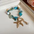 Vista detallada de gargantilla de playa con piedra natural azul y colgante de estrella de mar - 4# Collar con Colgante de Estrella de Mar y Venera