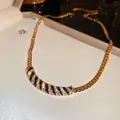 Elegant gold-tone chain necklace with black enamel stripes and shimmering rhinestones - 52# Flat Snake Bone Chain