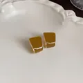 Macro detail view showing the glossy coffee enamel finish of these vintage stud earrings. - Geometric Rhombus