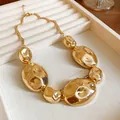 Chunky irregular geometric gold metal necklace with liquid metallic finish on a jewelry tray. - Lava Gold Flow Necklace (7#) / Gold