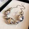 Detailed view of a silver irregular geometric metal necklace on a professional display tray - Liquid Metal Necklace (9#)