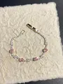 Vista dettagliata dell'elegante bracciale con zirconi rosa su carta - 1# Braccialetto in Zirconia Rosa Colorato (WB941) / Oro-Rosa