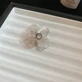 Elegant silver filigree flower ring featuring a sparkling central crystal on a display - Hollow Petal Single Stone Ring (46#)