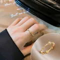 Elegant 18K gold plated open ring featuring cat eye opal stones and vintage Roman textures - Round Cat Eye Stone