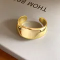 Detail showing the smooth polished gold-tone finish of this minimalist vintage cuff bracelet. - 13# Bangle-Gold