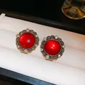 Detailed view of elegant red crystal stud earrings with golden filigree and silver pin - 18# Silver Pin - Red