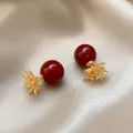 Detailed close-up of elegant red pearl earrings featuring golden floral diamond accents - 27# Silver Needle-Gold-Red