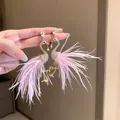 Detailed macro view of elegant pink feather flamingo earrings with sparkling rhinestone crystals - Pink Flamingo Style (HE16158)