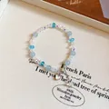 Bracciale di perle di cristallo azzurro con ciondolo a cuore iridescente e sfaccettature - Braccialetto a Scorrimento con Cuore in Perline Opache (61#) / Blu