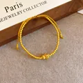 Elegante bracciale di perle dorate con ciondolo a zucca in filigrana e zircone rosso - Braccialetto in Zirconia Rossa con Zucca in Filigrana Traforata (70#) / Oro