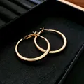 Elegant gold-plated minimalist hoop earrings with silver needles on black velvet display - Medium (4#)
