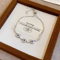 Bracciale regolabile malocchio color argento con pietre di zircone blu e bianche brillanti - 77# Braccialetto in Zirconia Malocchio (WB941) / Argento-Blu