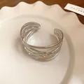 Detailed view of silver multi-layered open cuff bracelet with leaf-like metal texture. - Woven Texture Style (HB3844) / Silver