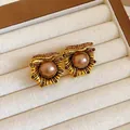 Detail of vintage court style flower stud earrings with bronze pearls and crystals - Silver Earring Post Style