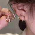 Elegante goldfarbene Spiralkrallen-Ohrringe mit glitzerndem CZ-Inlay für Frauen - Gold Geometrischer Stil (9#)