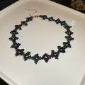 Dark blue iridescent beaded flower choker necklace with adjustable gold extender chain - Gold-Blue