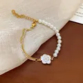 Elegant vintage pearl bracelet featuring a white camellia flower and sparkling rhinestone chain - Camellia Pendant Style (34#) / Gold/White